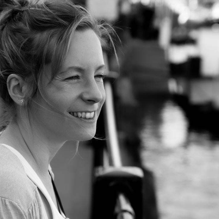 Kaveri Mehta, Lead Design Curator at SilverCompassGo, reviewing corporate floral arrangements